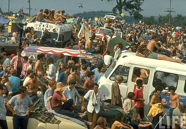 Bob stitting atop the bus at Woodstock